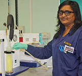 Senior laboratory assistant Sheila Naidoo operates the new air release instrument.